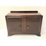 ART DECO MAHOGANY SIDEBOARD with a raised back above a stepped top with a pair of cupboard doors