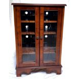 YEW WOOD HI-FI CABINET with a square moulded lift up lid above a pair of glass doors opening to