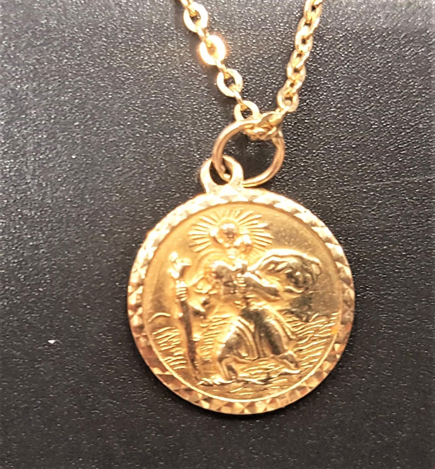 NINE CARAT GOLD SAINT CHRISTOPHER PENDANT with relief decoration, on nine carat gold chain, total