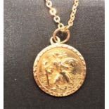 NINE CARAT GOLD SAINT CHRISTOPHER PENDANT with relief decoration, on nine carat gold chain, total