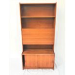 GIBBS TALL TEAK COMBINATION BOOKCASE with two shelves above a fall flap with a shelf below and a