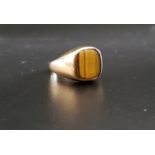 TIGER'S EYE SIGNET RING on nine carat gold shank, ring size L and approximately 4.1 grams