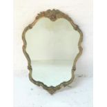 SHAPED SILVERED FRAME WALL MIRROR with floral decoration, 75.5cm high