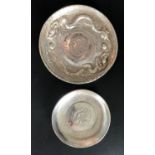 TWO CHINESE COIN CENTERED WHITE METAL PIN DISHES both with 7 Mace and 2 Candareens coins to