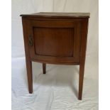 BOW FRONT MAHOGANY AND INLAID POT CUPBOARD with a moulded top above a panelled door opening to