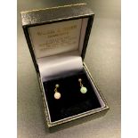 PAIR OF OPAL DROP EARRINGS the spherical opal drops in nine carat gold