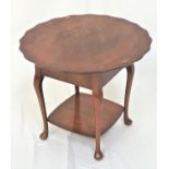 WALNUT SEWING TABLE with a circular lift up top with a wavy rim revealing a padded lined box,