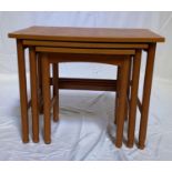 SCHREIBER TEAK NEST OF TABLES each with a shaped top, standing on turned supports united by a