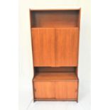 GIBBS TEAK TALL BOOKCASE with a shelf above a pair of large cupboard doors with a shelf below and