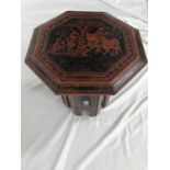 BURMESE LACQUERED OCCASIONAL TABLE with an hexagonal top decorated with a horse and figures, the