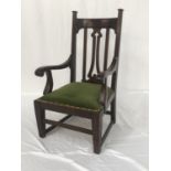 ART NOUVEAU MAHOGANY ARMCHAIR with a shaped top rail flanked by finials, with a central pierced