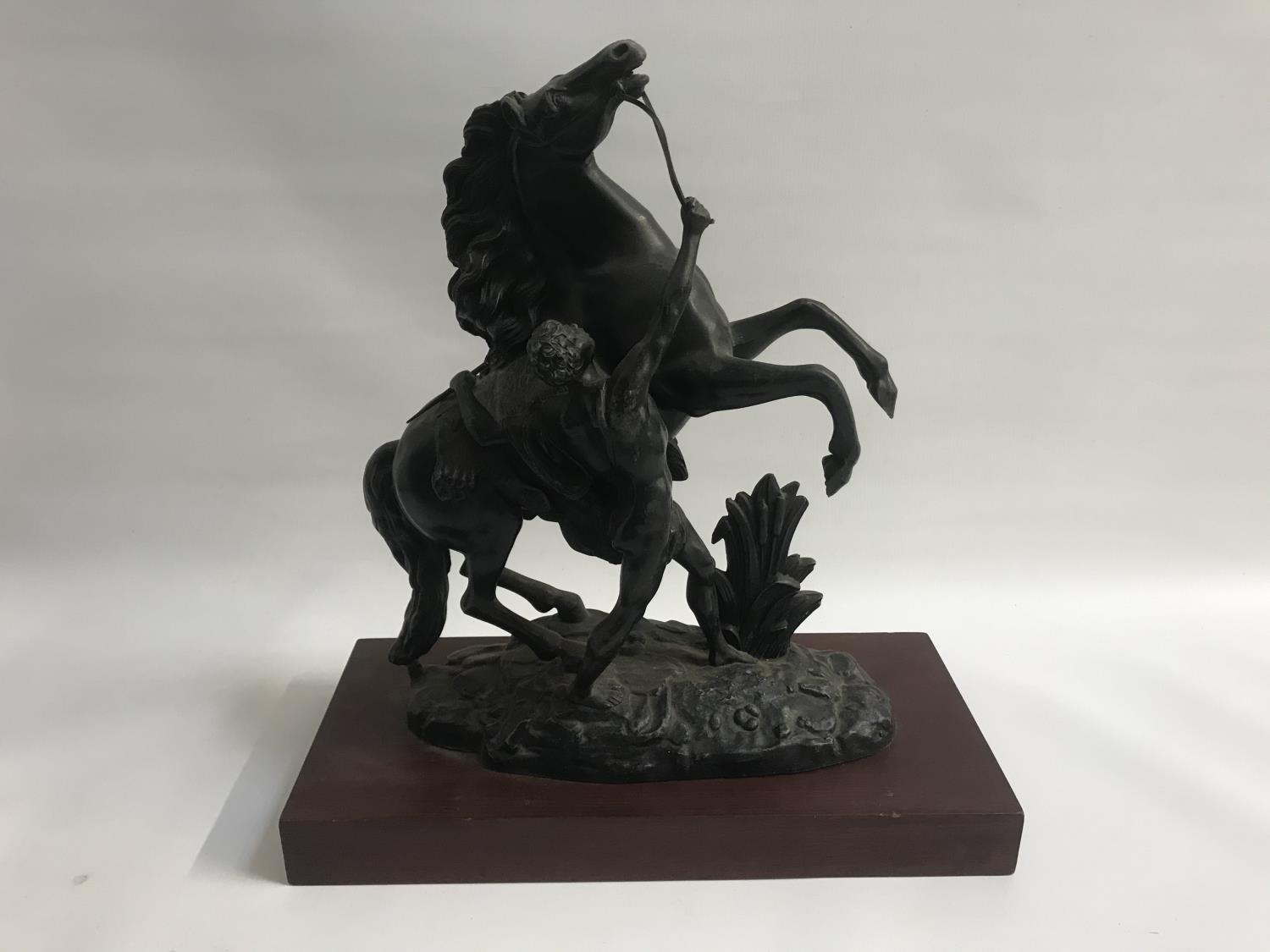 SPELTER FIGURE ORNAMENT depicting a classical scene of rearing stallion with attendant, on