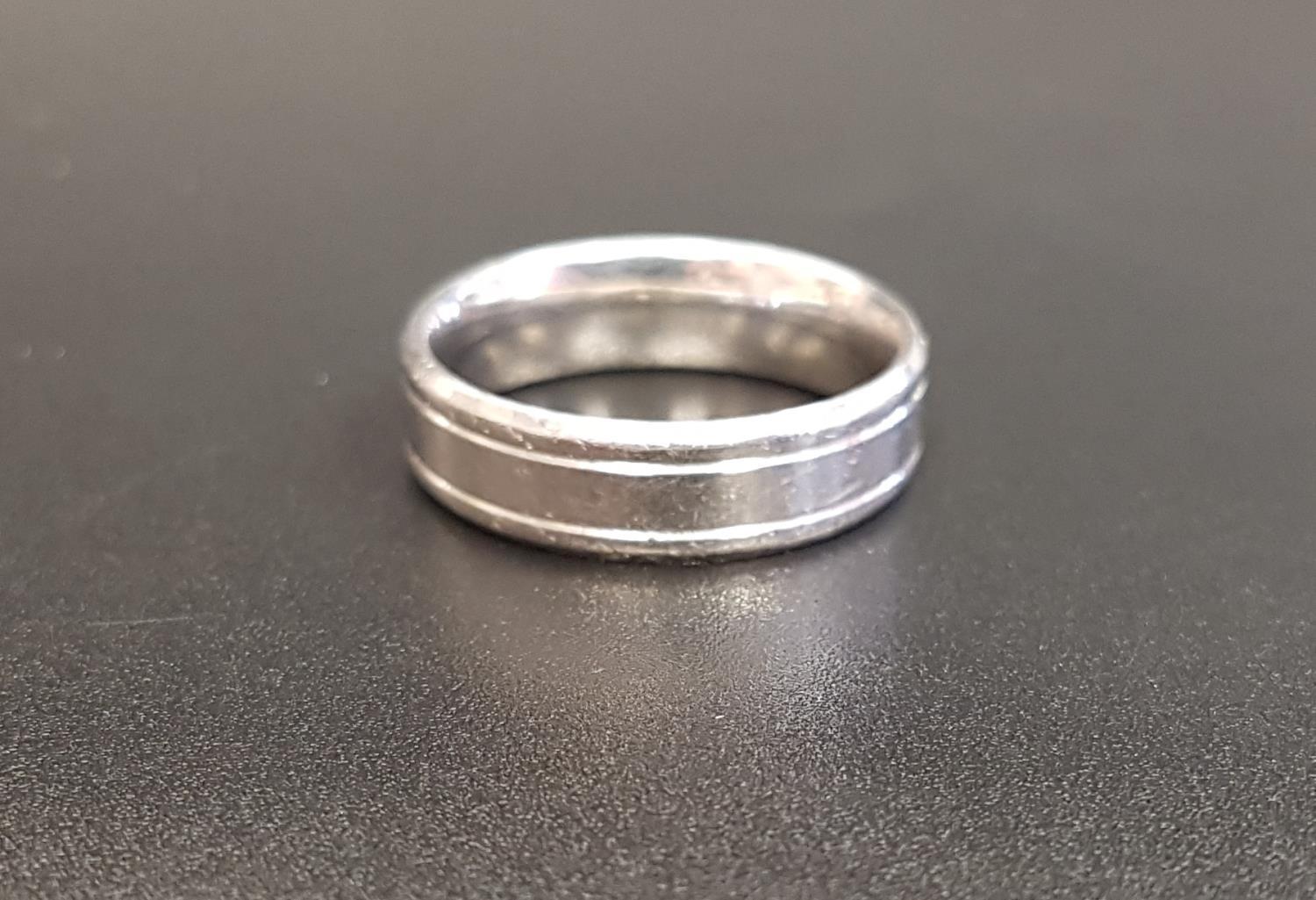 PLATINUM WEDDING BAND with engraved detail, ring size R-S and approximately 6.4 grams