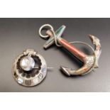 TWO SCOTTISH AGATE SET BROOCHES comprising one in the form of an anchor, 7.3cm high including