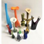 TWELVE COLOURFUL GLASS VASES of various sizes and designs, heights ranging from 49cm to 17.7cm