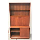 DANISH TEAK COMBINATION BOOKCASE with two shelves above a fall flap opening to reveal a fitted