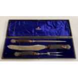 LATE VICTORIAN HORN HANDLED CARVING SET comprising knife, fork and steel, the knife marked J.