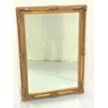 GILTWOOD OBLONG WALL MIRROR with a bevelled plate, 106.5cm x 60cm