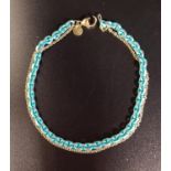 UNUSUAL TWO STRAND CHAIN BRACELET one strand a fourteen carat gold chain and the other a turquoise