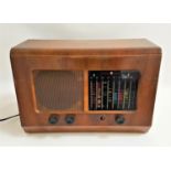 PYE RADIOGRAM in a walnut case with a coloured glass tuning panel with dials below, mains operated