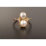 UNUSUAL PEARL AND DIAMOND RING the two vertically set cultured pearls flanked by three small