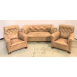 CHESTERFIELD SUITE comprising a button back sofa with scroll arms and two button back armchairs with