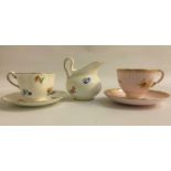 NEW CHELSEA PORCELAIN TEA SERVICE the white ground decorated with flowers and gilt highlights,