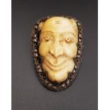IVORY DEVIL'S MASK BROOCH the carved ivory head in unmarked silver, 4cm high