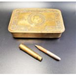 WWI BRASS EMBOSSED CHRISTMAS TIN decorated with Princess Mary, together with bullet pencil (2)