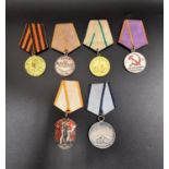 SIX SOVIET RUSSIAN MEDALS including the For Valour medal numbered 685927, Defence Of Leningrad