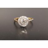 EDWARDIAN DIAMOND CLUSTER RING the central round brilliant cut diamond approximately 0.55cts, in