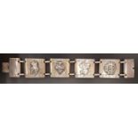 SOUTH AFRICAN STERLING SILVER BRACELET by Haglund, the panel links relief decorated with a