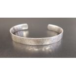 GEORG JENSEN SMITHY SILVER BANGLE the hammered silver bangle numbered 590, size M/L