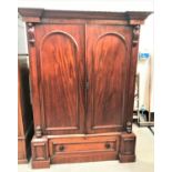 VICTORIAN MAHOGANY WARDROBE with an inverted breakfront moulded cornice above a pair of panelled