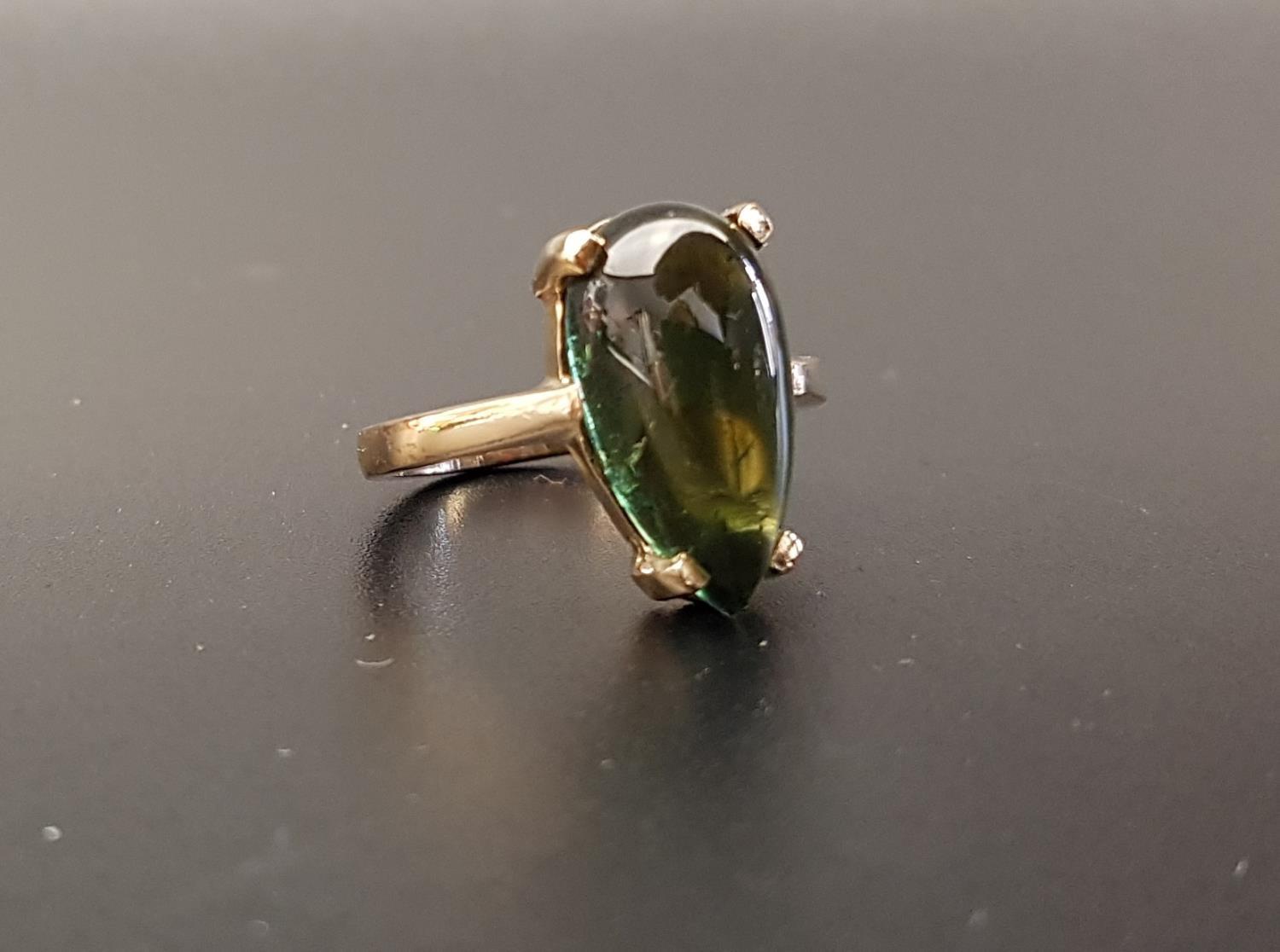 GREEN TOURMALINE SINGLE STONE RING the cabochon pear cut tourmaline in nine carat gold, ring size