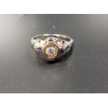 ART DECO DIAMOND AND SAPPHIRE RING the central round cut diamond approximately 0.25cts with