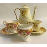 ROYAL STAFFORD COFFEE SERVICE the white ground decorated with yellow leaves with gilt highlights,