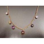 GEM SET UNMARKED GOLD CURB LINK NECK CHAIN the chain with six gemstone drops and loops for an