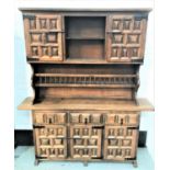 CONTINENTAL STYLE TEAK DRESSER with a plain moulded top above a central open shelf flanked by a pair