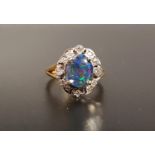 OPAL TRIPLET AND DIAMOND CLUSTER RING the central oval opal triplet approximately 1cm x 0.8cm, in