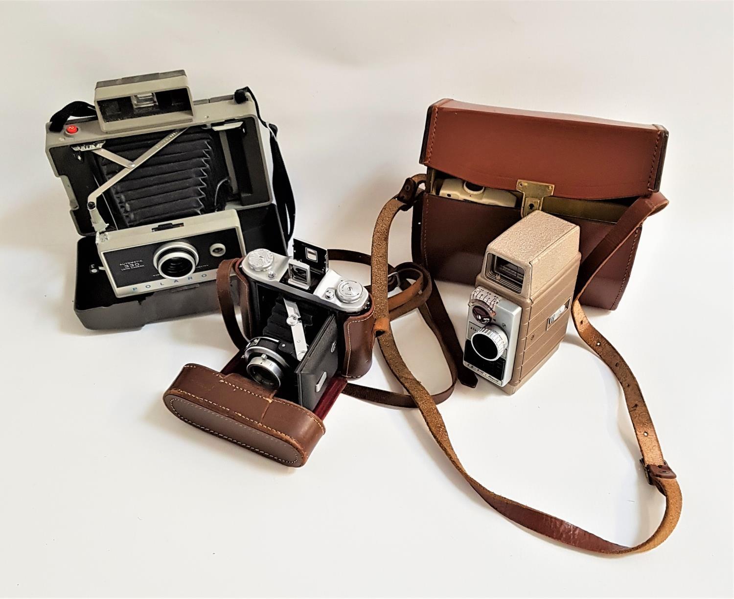 SELECTION OF PHOTOGRAPHIC CAMERAS including a cased Polaroid Automatic 330 Land Camera, a cased