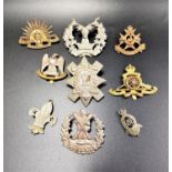 SELECTION OF MILITARY BADGES including the Gordon Highlanders, Royal Scots Greys, Notts & Derby