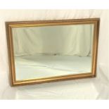 GILT FRAME WALL MIRROR with a bevelled plate, 71.5cm x 102cm