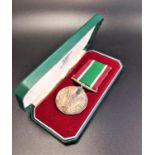 WOMEN'S VOLUNTARY SERVICE MEDAL with a spare ribbon, cased