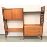 1970'S LADDERAX TEAK MODULAR WALL UNIT comprising three ladder style uprights, a cupboard with a