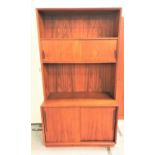 DANISH TEAK CABINET with a shelf above a pair of sliding cupboard doors and a shelf below with a