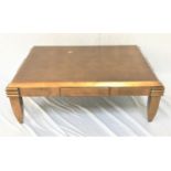 GILTWOOD OCCASIONAL TABLE the oblong top with canted edges, standing on tapering supports, 122cm