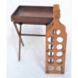 TEAK BUTLERS TRAY with raised sides and brass carrying handles, on a folding X frame, 72cm high,