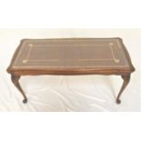 MAHOGANY OCCASIONAL TABLE the oblong top with inset leather under glass, standing on cabriole