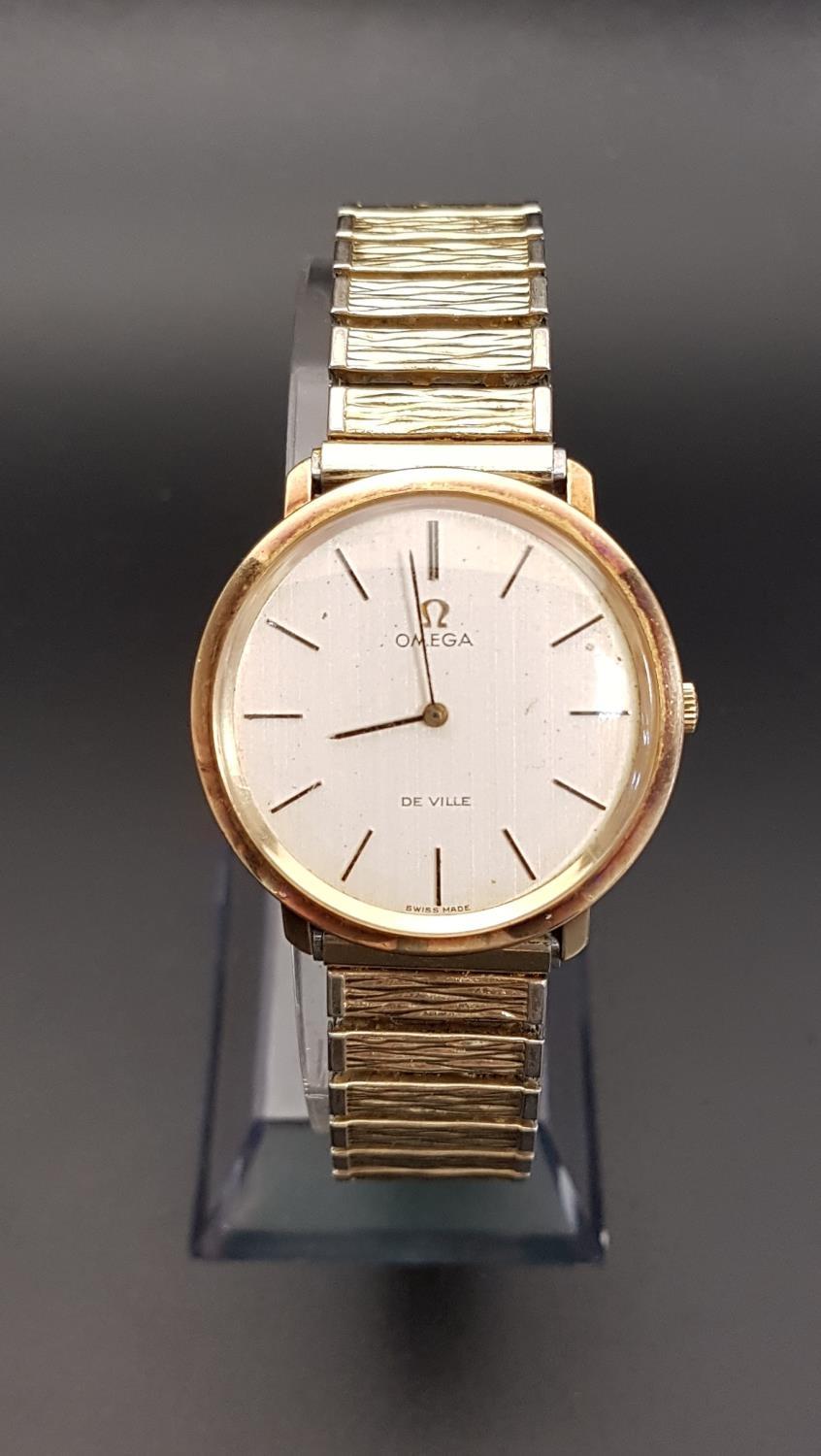 GENTLEMEN'S 1970s OMEGA DE VILLE NINE CARAT GOLD CASED WRISTWATCH the champagne dial with baton five